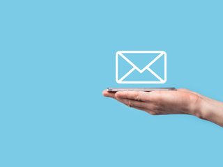 hand holding a mail icon