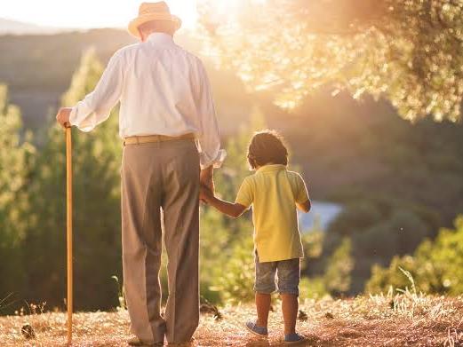 grandfather and grandson walking