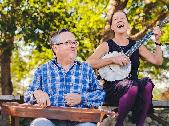 man and woman playing instruments